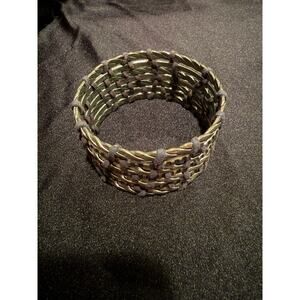 Silver tone vintage cuff bracelet featuring braided metal and leather wrapped